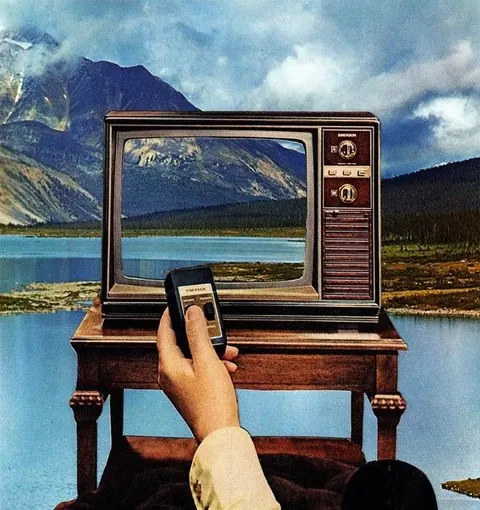 Collage: a vintage TV on a wooden table in front of mountains and a lake, a hand pointing a remote at it.